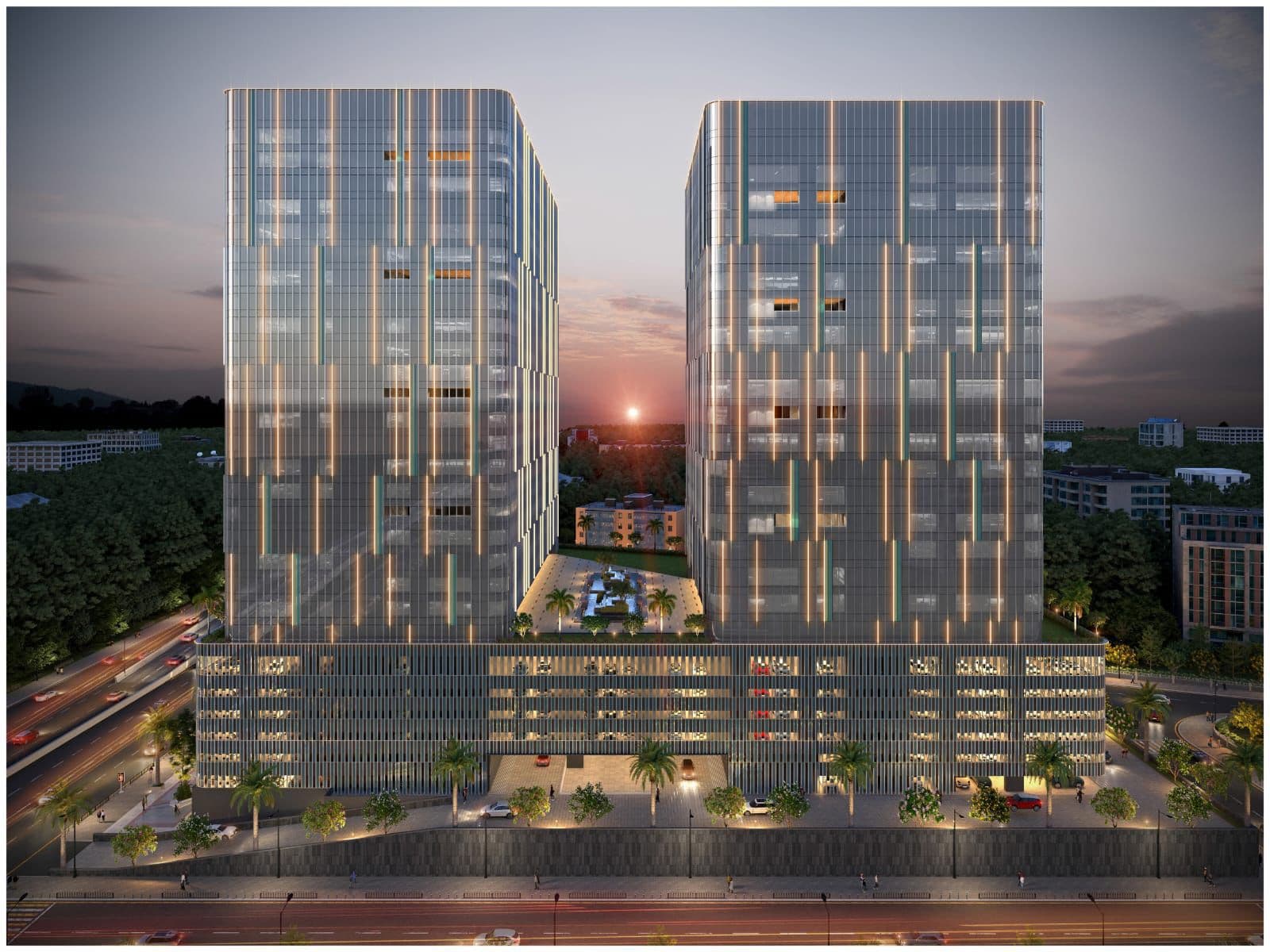 Kamdhenu Synergy Square — twin towers at sunset